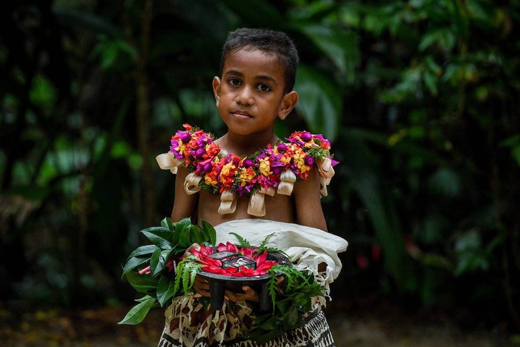 A traditional Fiji page boy carries the wedding rings