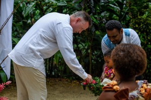 The groom picks a ring from the Fiji page boy