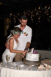 The bride and groom cut their wedding cake at their reception