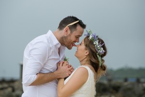 The groom playfully licks his bride's nose