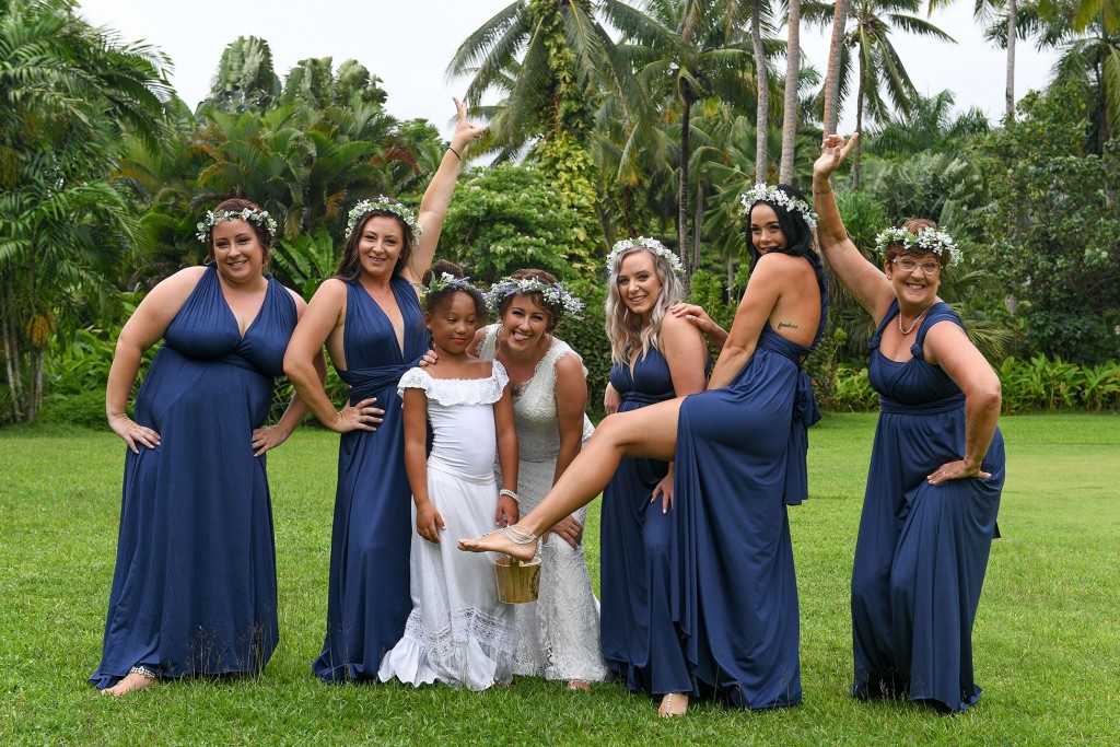 The bridal party pose for a saucy and fun picture before the wedding