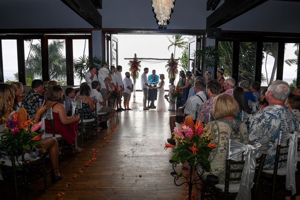 Wedding guests watch the wedding ceremony at Warwick Fiji