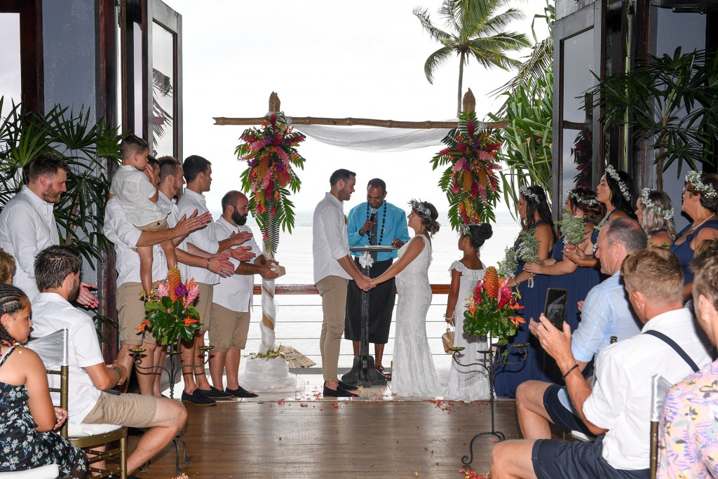 The newly weds exchange their vows at the tropical Fiji flower altar