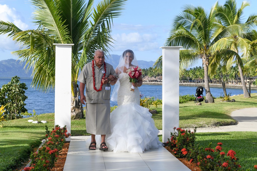 The father walks the bride down the aisle at the Sheraton Fiji