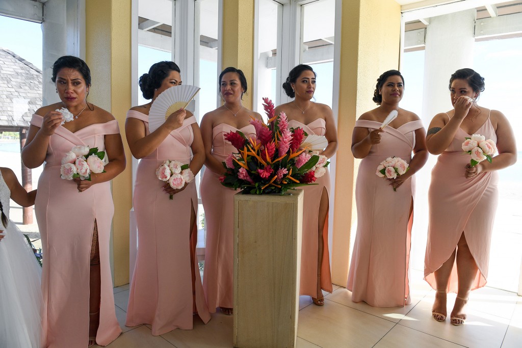 The bridesmaids tear up as the vows are recited