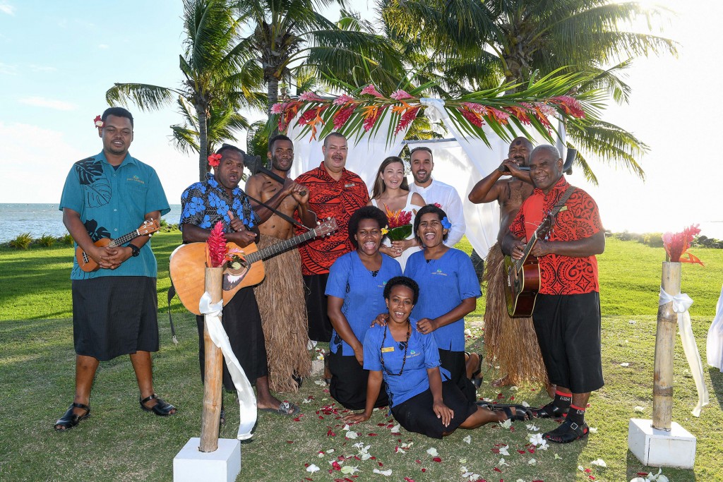 The traditional Fiji bridal team at Fiji landing pose for a picture