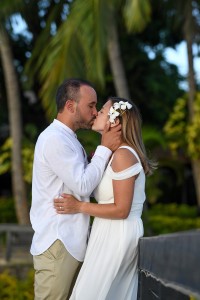 A portrait of the couple's passionate kiss against Fiji palm trees
