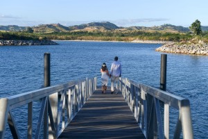 The couple stroll on the dock