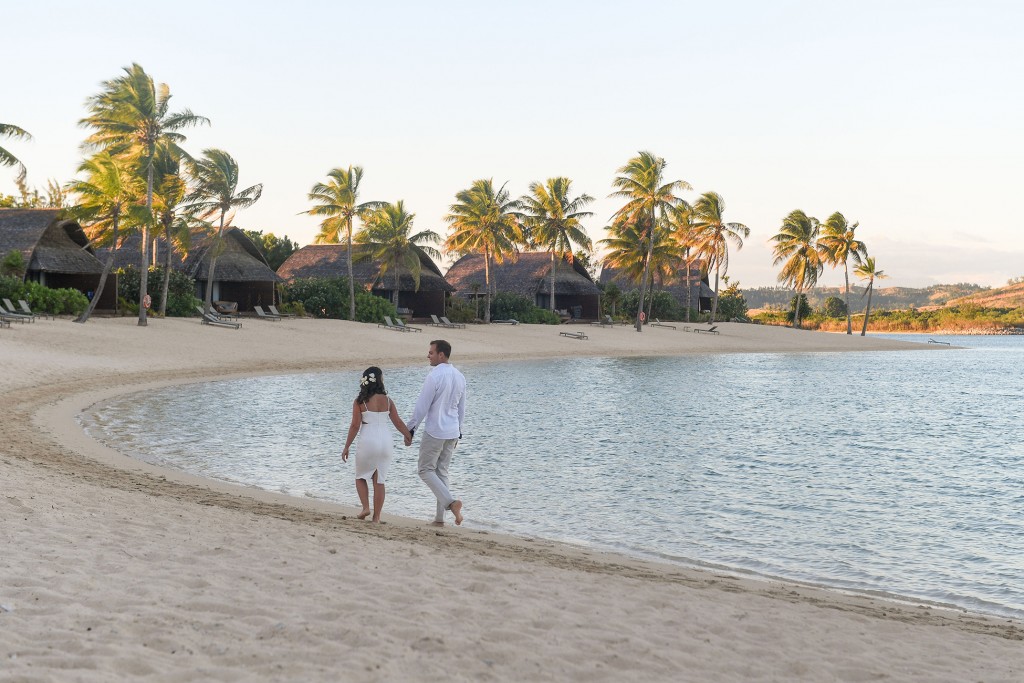 The couple take an anniversary stroll along the beach