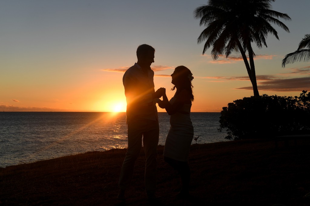 An intimate silhouette of the couple against the golden Fiji sunset