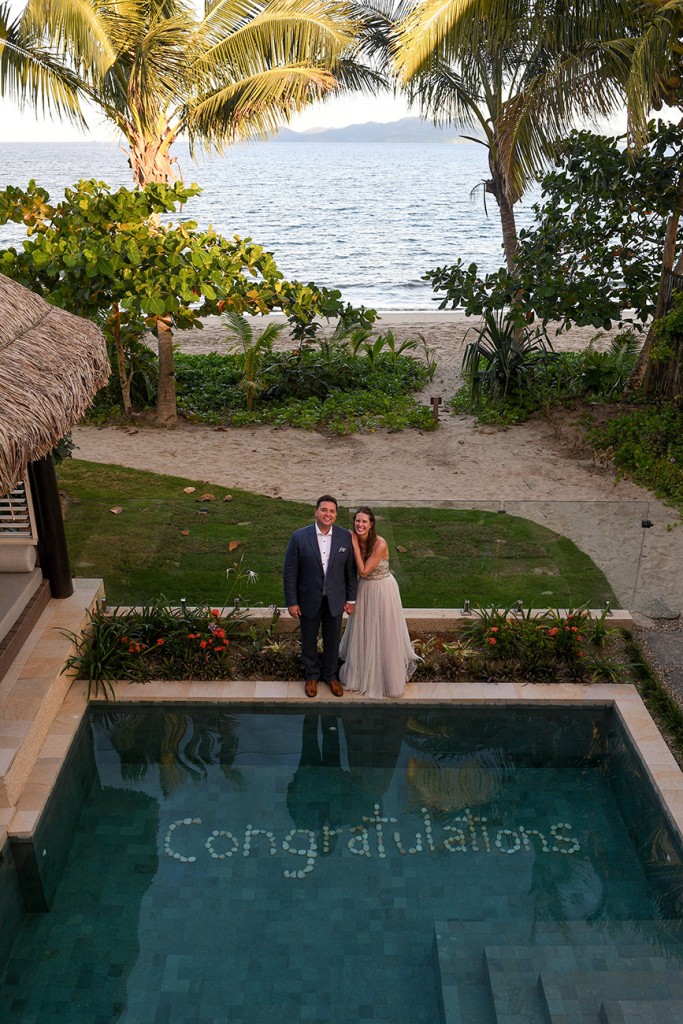 An aerial shot of Congratulations in the couple's private pool
