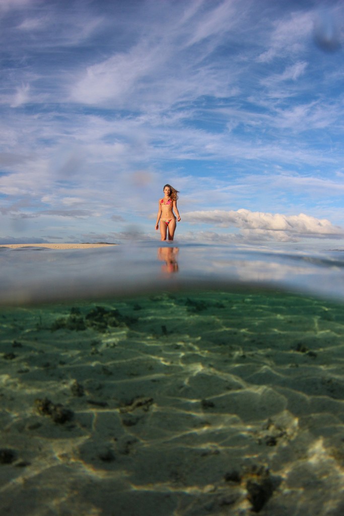 The bombshell blonde strolls in shallow waters of Fiji reef