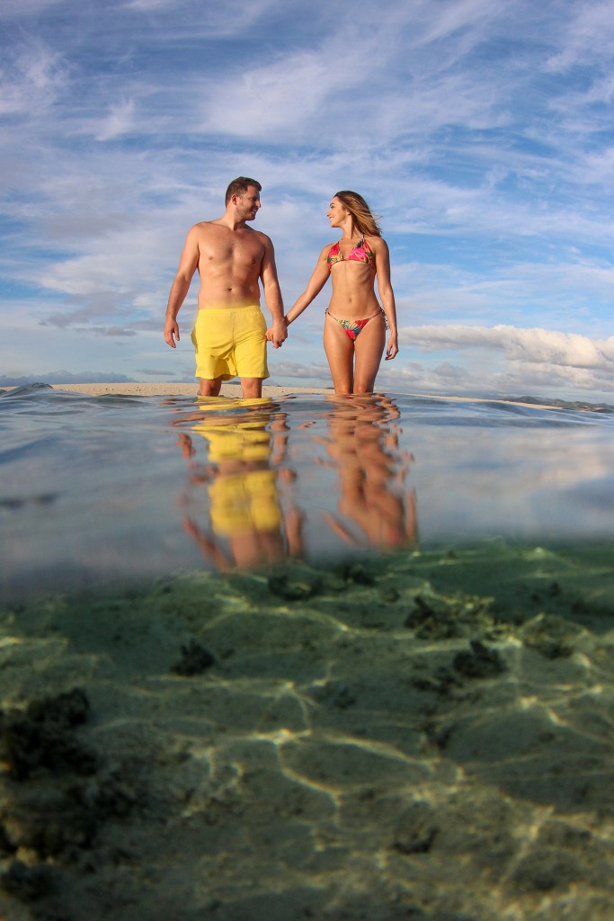 The fine couple hold hands in the shallow reefs of Nadi Fiji