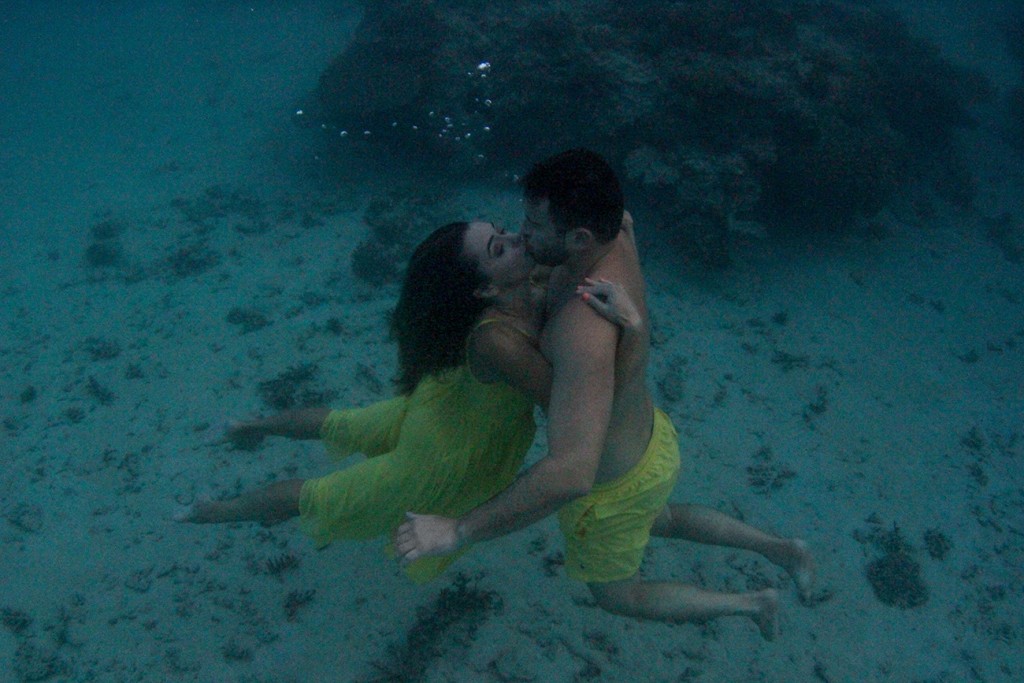 The couple passionately kisses at the floor of the reef at Nadi Fiji