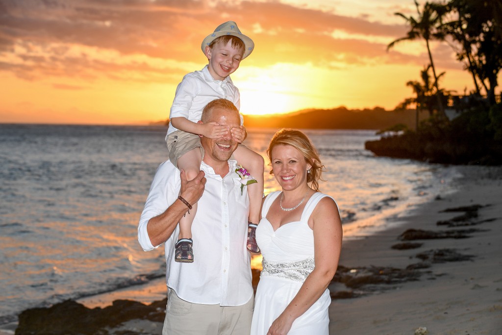 The new family goof around during a breathtaking Fiji sunset