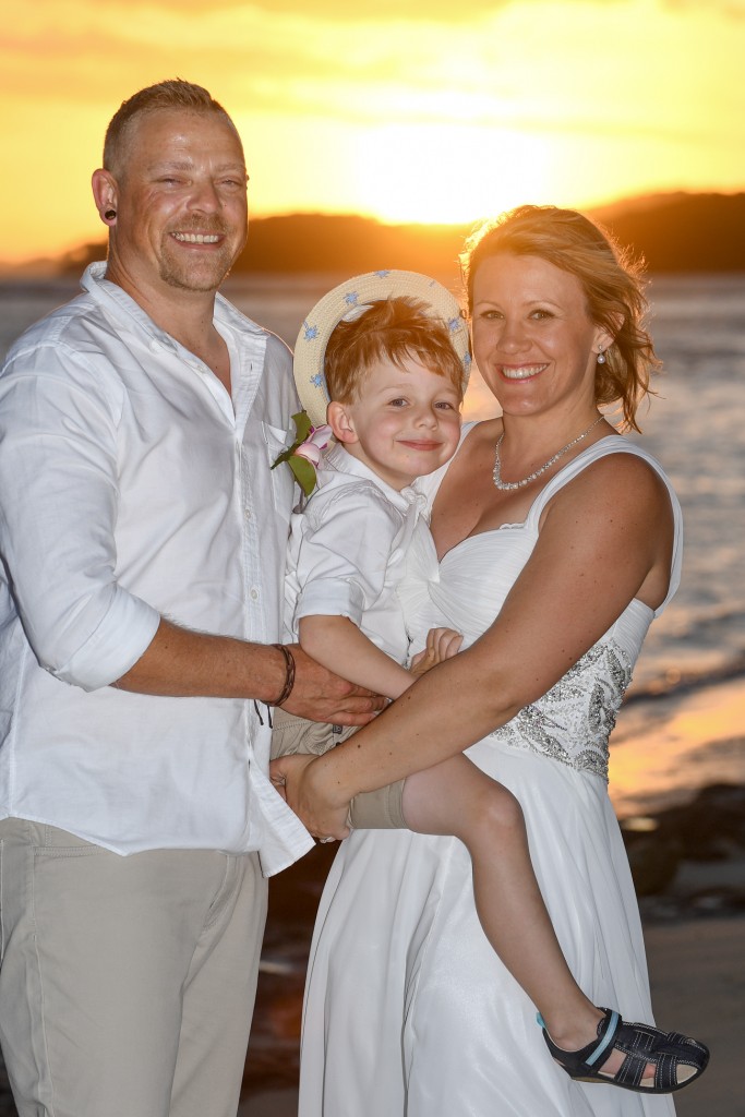 A picture perfect portrait of the family against the fiery Fiji sunset
