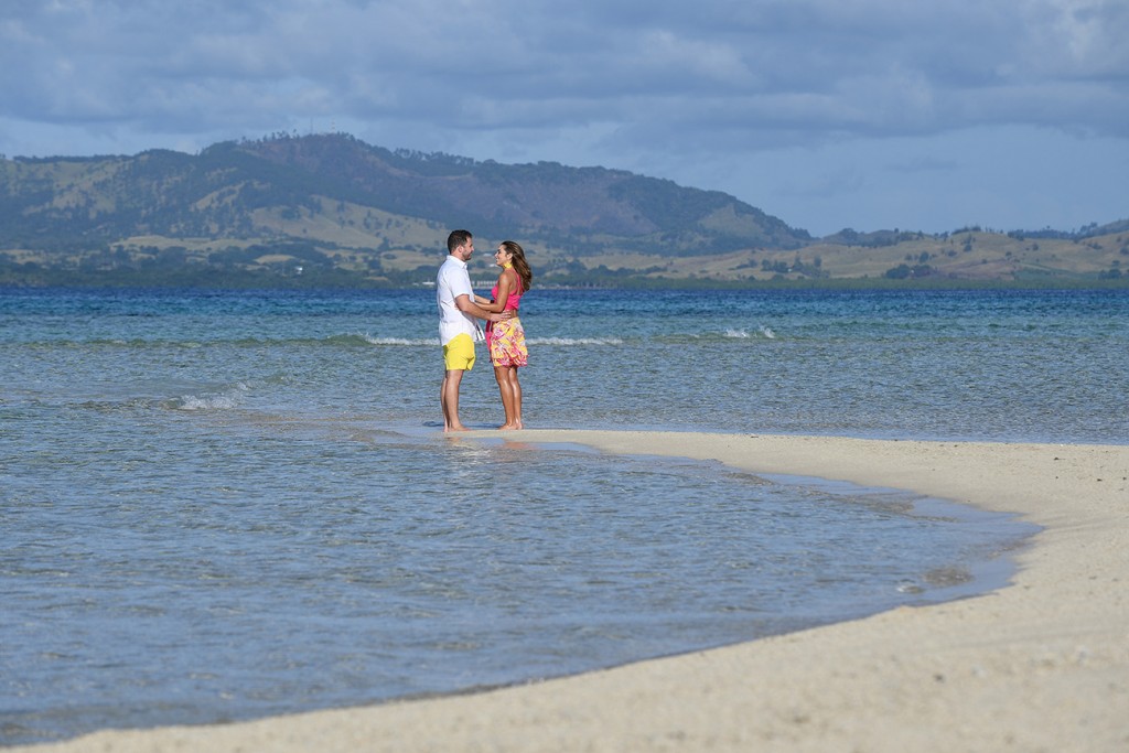 The couple hold hands at the shore of Nadi Fiji