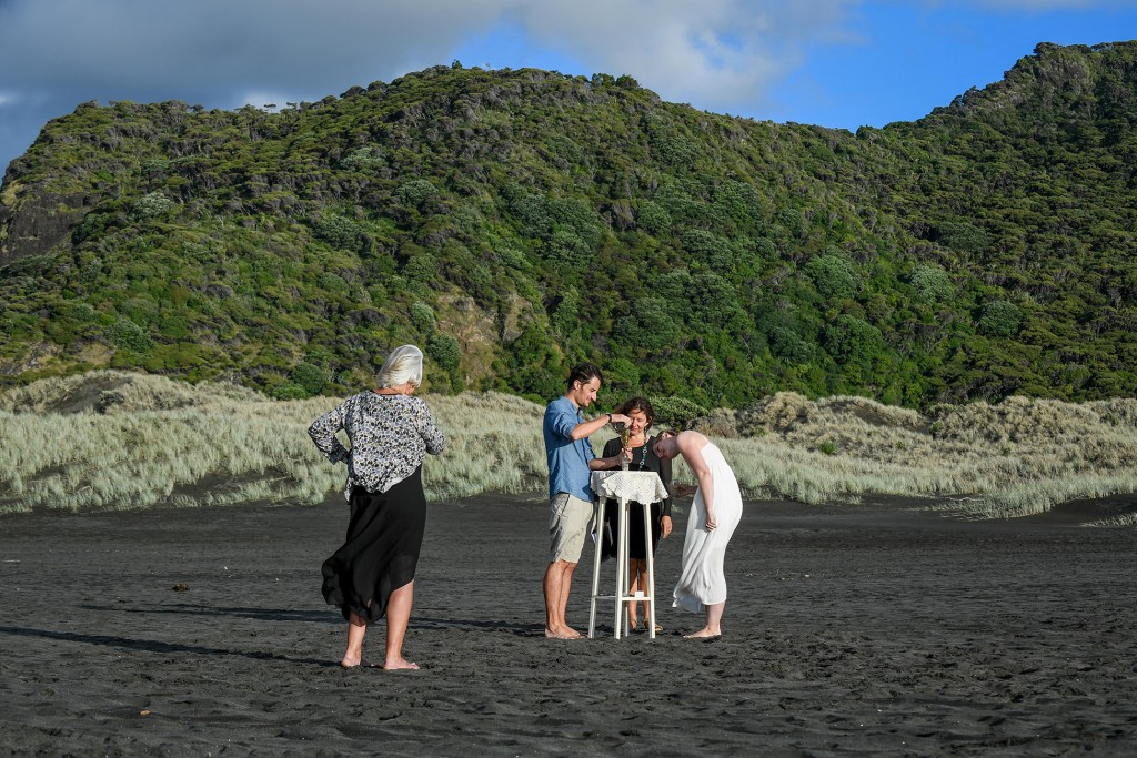 A long shot of the couple performing the sand ceremony