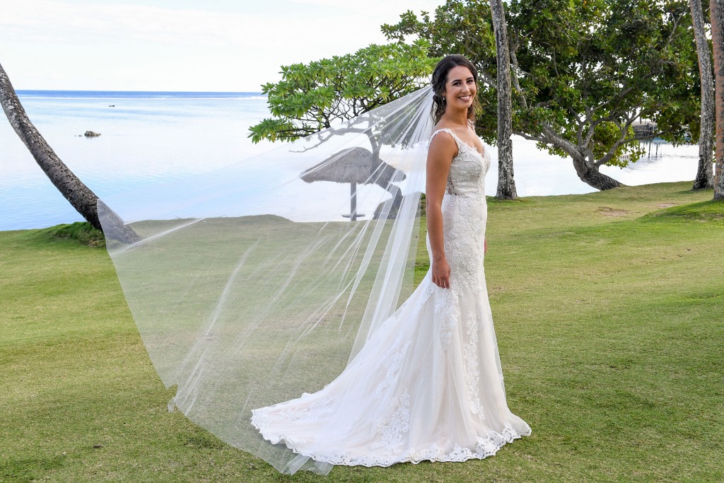 The bride's veil flies in the wind at Warwick Fiji
