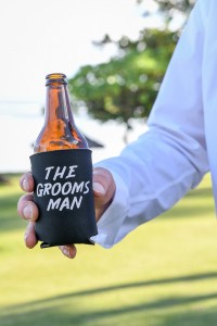 A closeup of the groomsman beer holder
