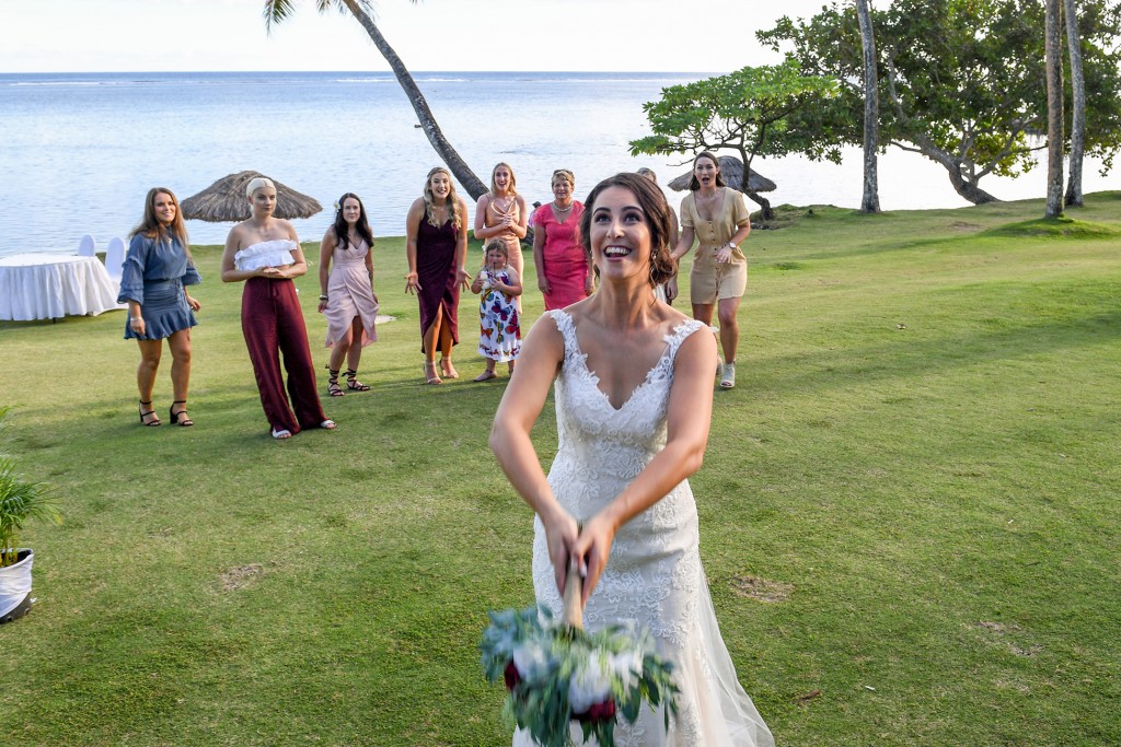 All the single ladies wait for the bride to toss the bouquet