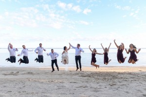 The bridal party leaps into the air at Warwick beach Fiji