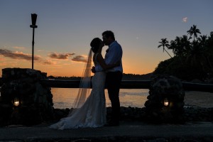 A silhouette portrait of the newly weds kissing at sunset in Warwick Fiji