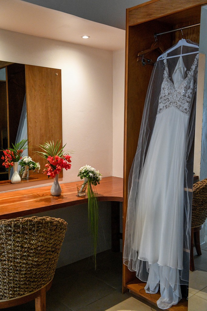 The Lilian West wedding gown draped in the reception before the wedding