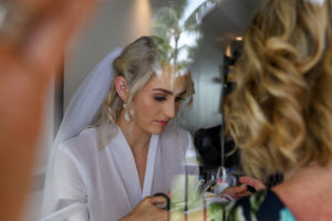 A peep of the stunning bride through the mirror