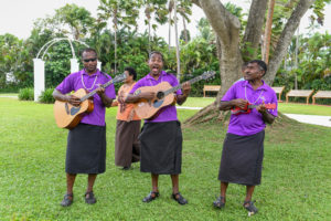 A traditional Fiji band plays the guitar and the ukulele