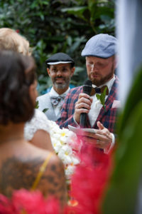 The groom reads his vows to the bride