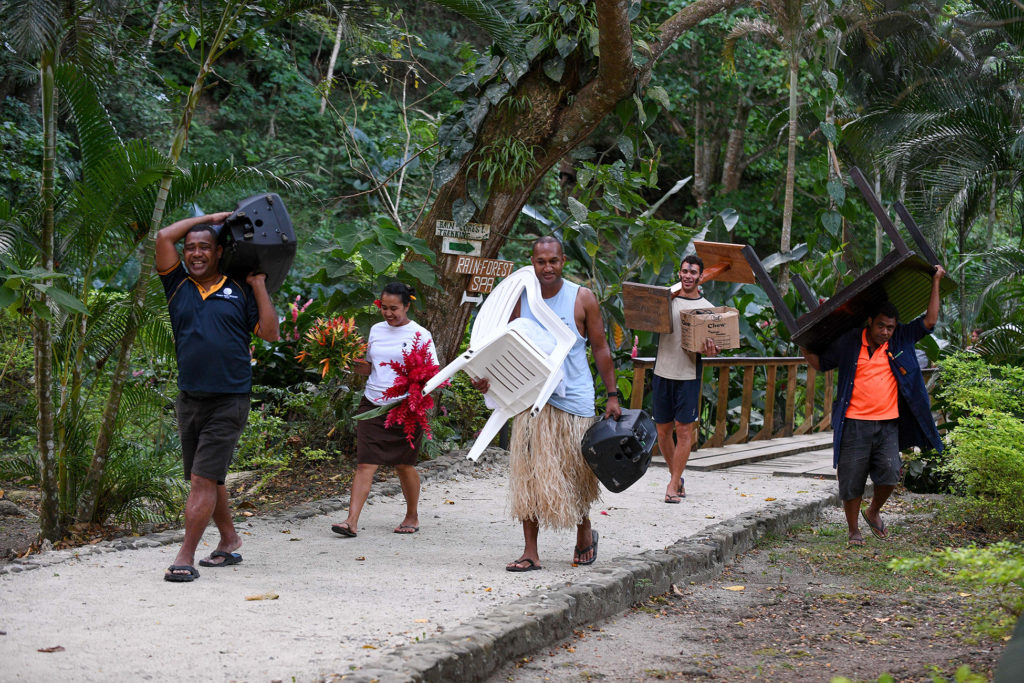 The Savusavu wedding party carries away all the wedding gear after the ceremony