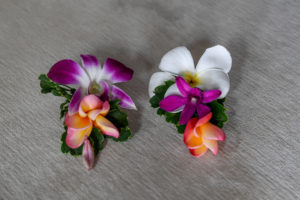 Simple and cute white and purple frangipani hairpins ready for the bride's hair