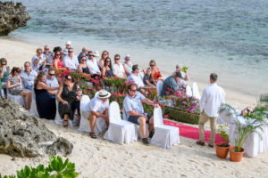 The wedding guests wait on the shores of Shangri La Fiji