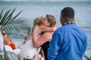 The bride hugs the celebrant