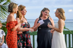 The bride catches up with her friends at the wharf of Shangri La Fiji